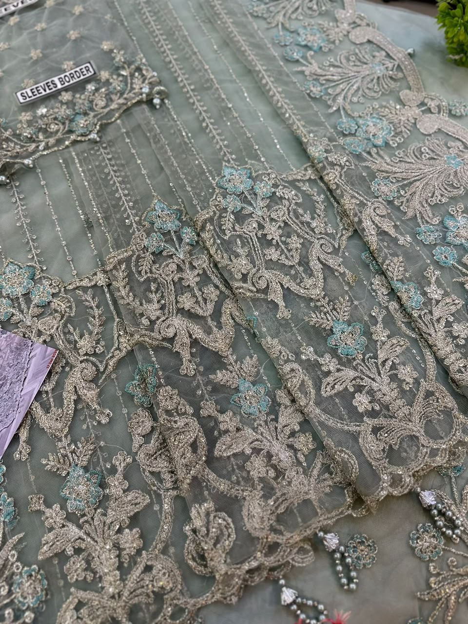 Net Heavy Embroidered Wedding Wear Saree - Unstitched
